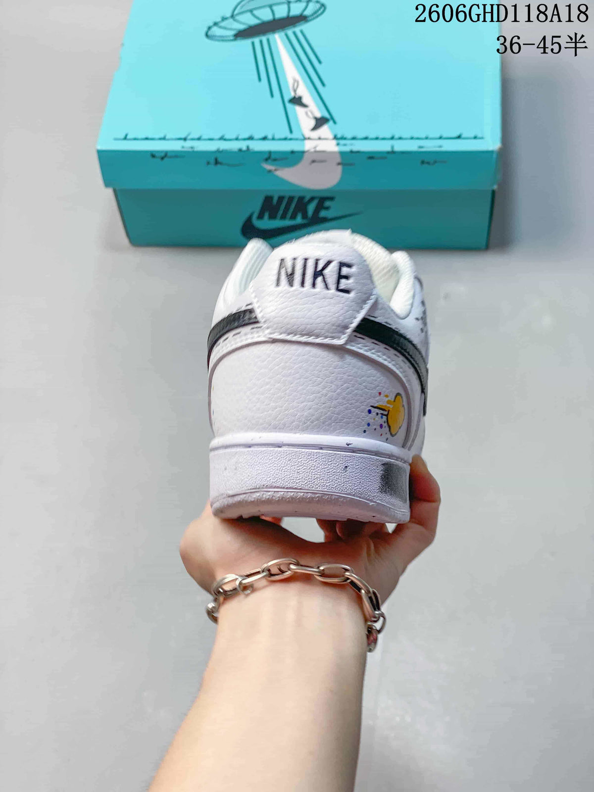 Rear view of the sneaker with Nike heel branding and a colorful graphic