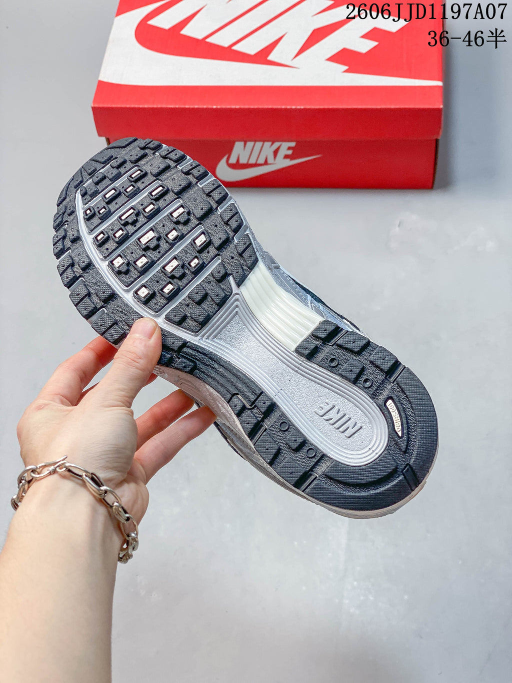 Underside of a Nike P-6000 sneaker showing its patterned dark outsole