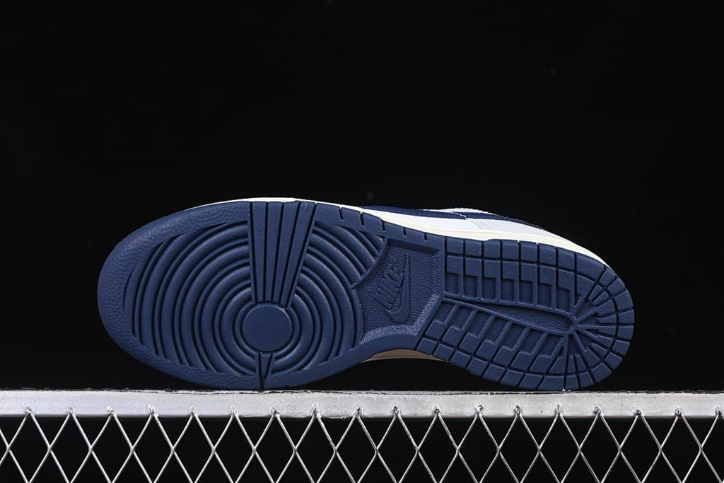 Underside view showing the navy patterned outsole