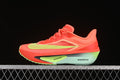 Side view of coral Nike Zoom Fly 6 running shoe with lime accents and pale blue-green midsole
