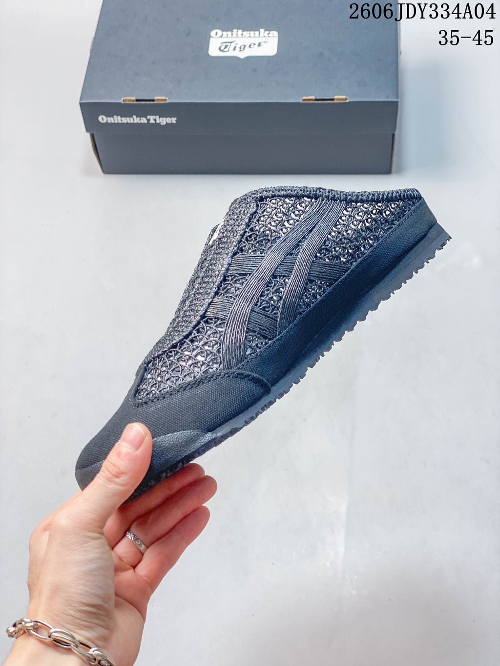 Side view of a dark navy Onitsuka Tiger Mexico 66 Sabot shoe.
