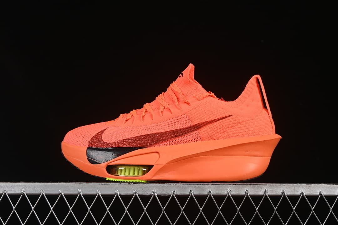 Side view of a bright orange Nike Alphafly running shoe with a dark Swoosh
