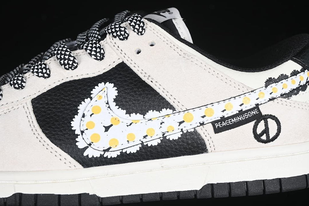Close-up of the daisy-patterned Swoosh, patterned laces, and peace-symbol detail