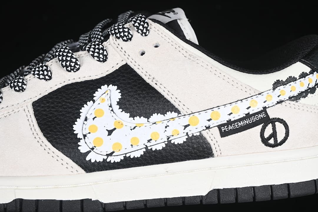 Close-up of the daisy-patterned Swoosh, patterned laces, and peace-symbol detail