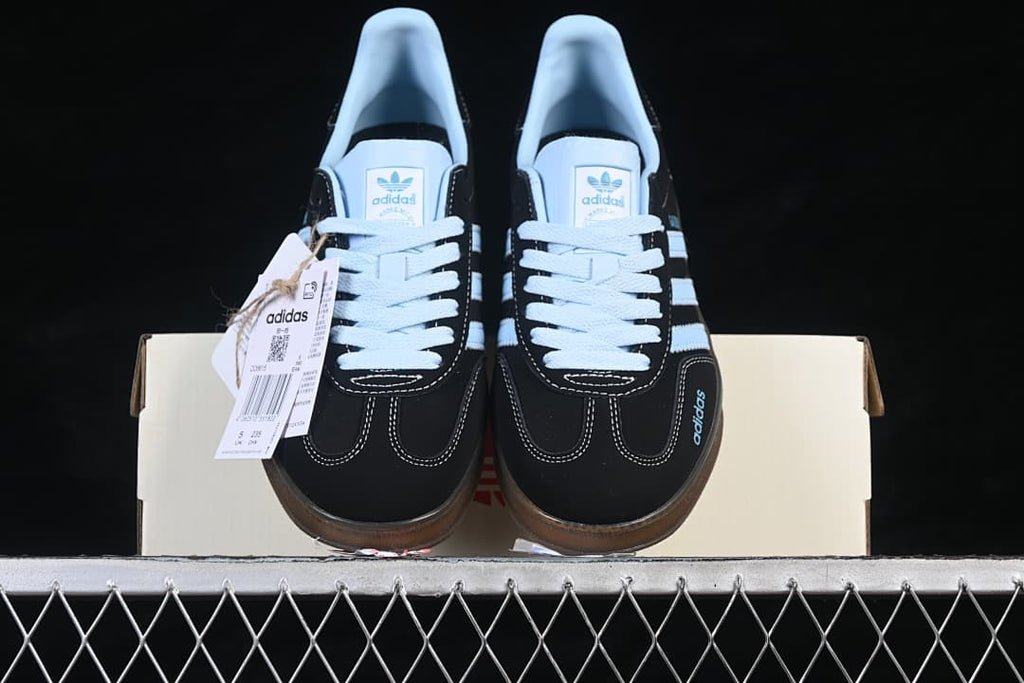 Front view of the pair showing the laces, toe stitching and gum-colored soles