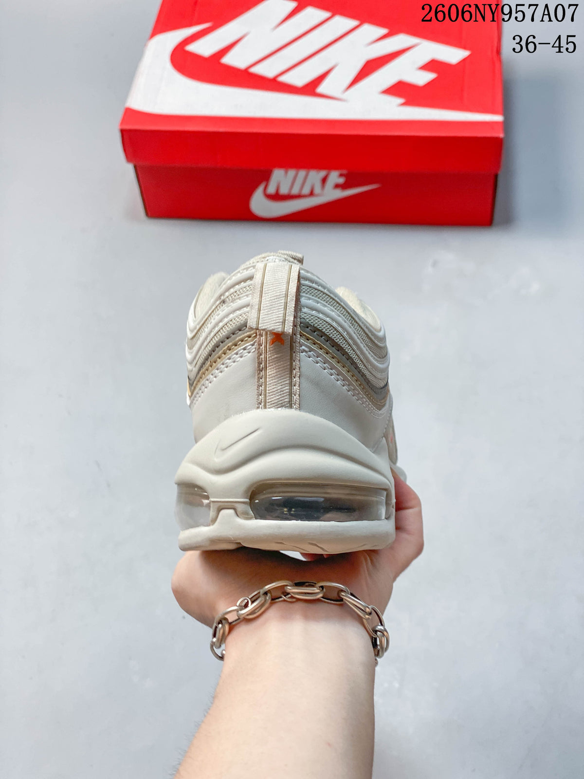 Rear view of a beige Nike Air Max 97 sneaker showing the heel air unit