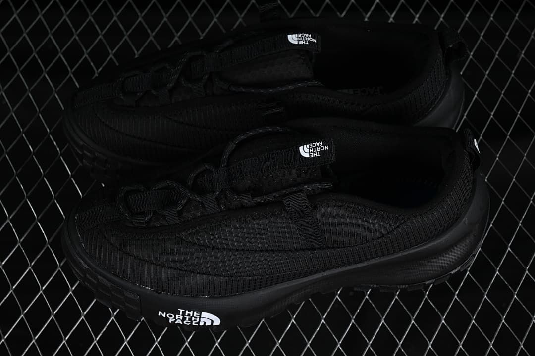 Pair of black low-top shoes shown from above and the side