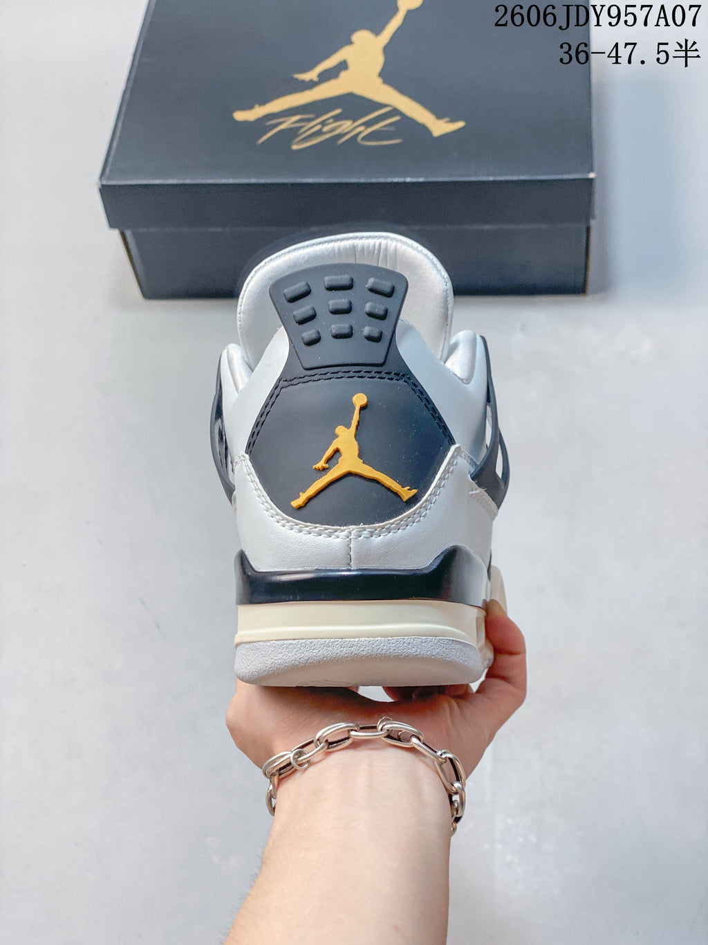 Rear view of a Jordan 4 sneaker with a contrasting heel detail