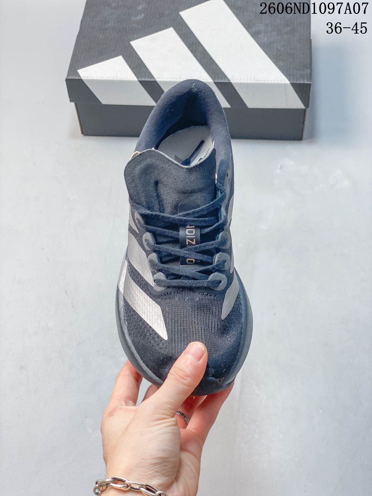 Top view of a dark gray lace-up running shoe with silver-tone side stripes.