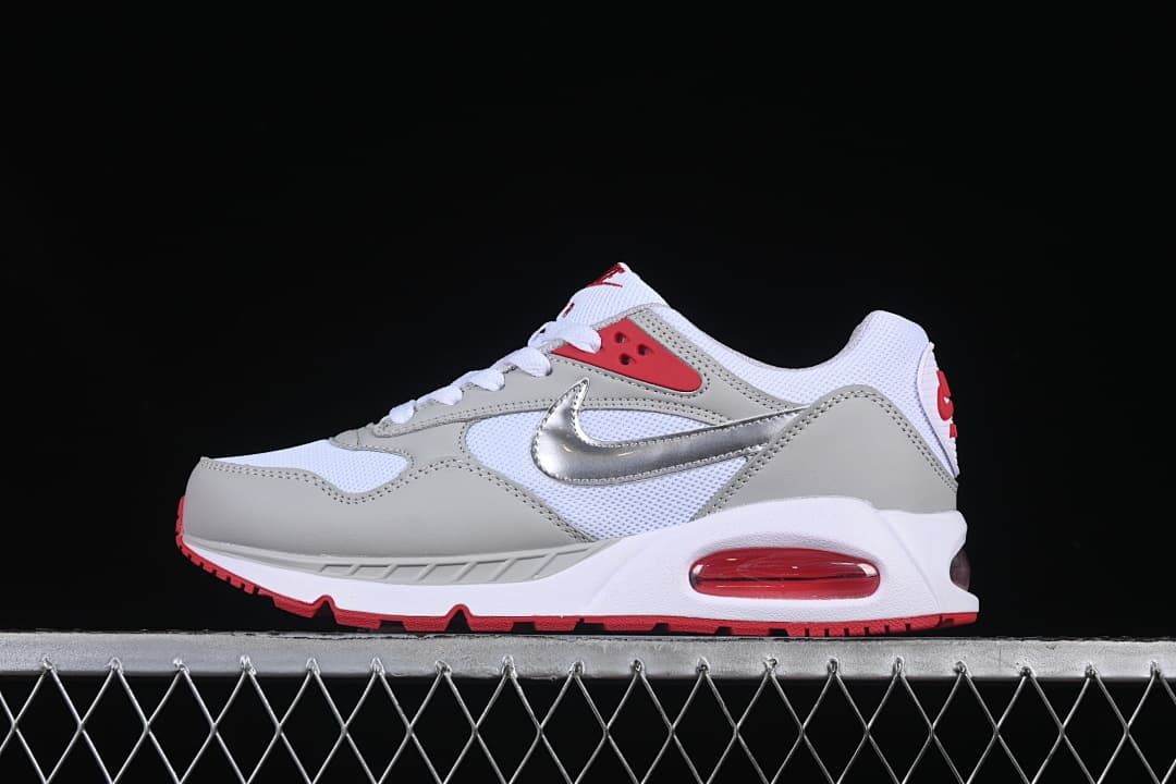 Side profile of a white, grey, red, and silver Nike Air Max Correlate sneaker.