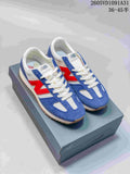 Pair of blue, white, and red New Balance 471 sneakers displayed on a shoe box