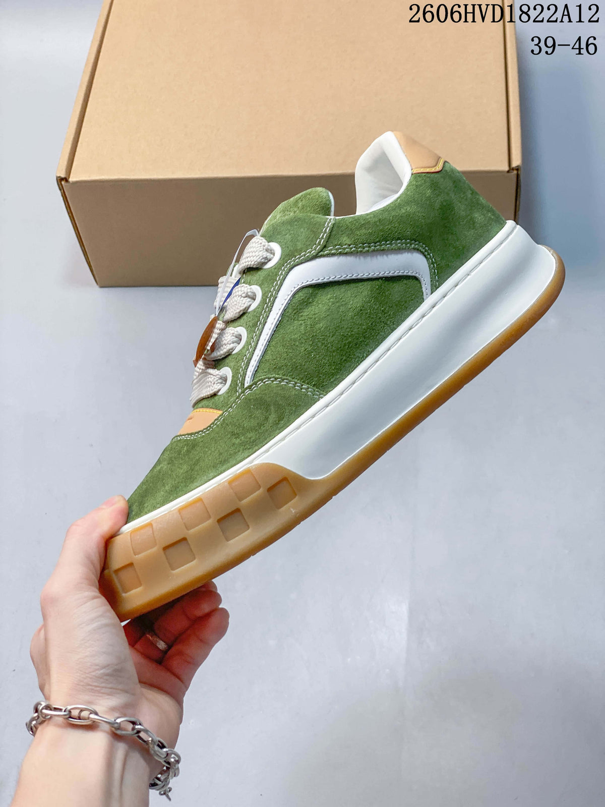 Side profile showing green upper, white side panel, and gum-colored outsole