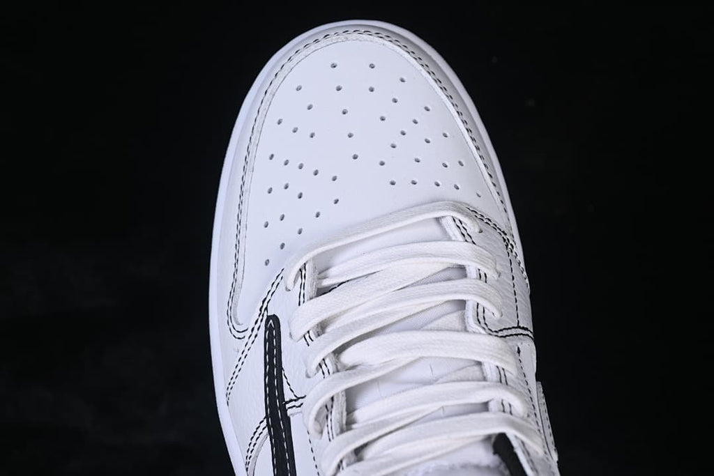 Top-down close-up of the perforated toe and lace area.