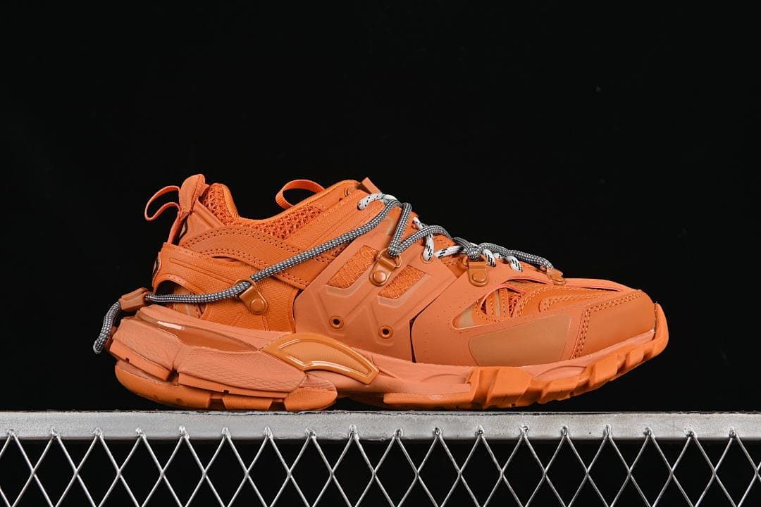 Side profile of the orange sneaker with patterned laces
