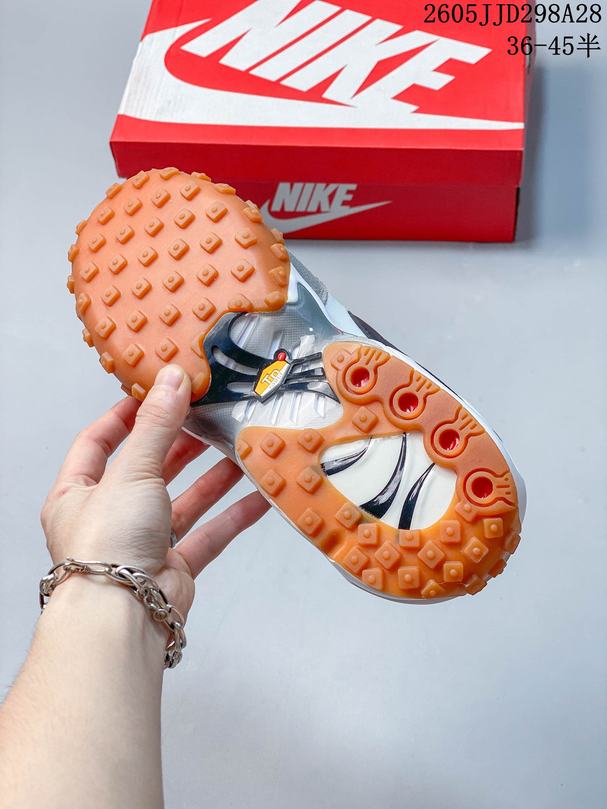 Underside view of a Nike Air Max Waffle SP sneaker showing its gum-colored raised-tread outsole.