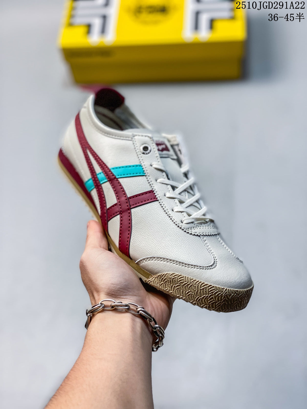 Angled view of an off-white Onitsuka Tiger sneaker with burgundy and turquoise stripes and a patterned gum-colored toe outsole.