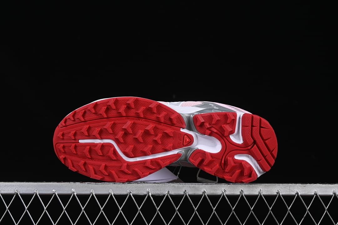 Underside view of the red patterned outsoles