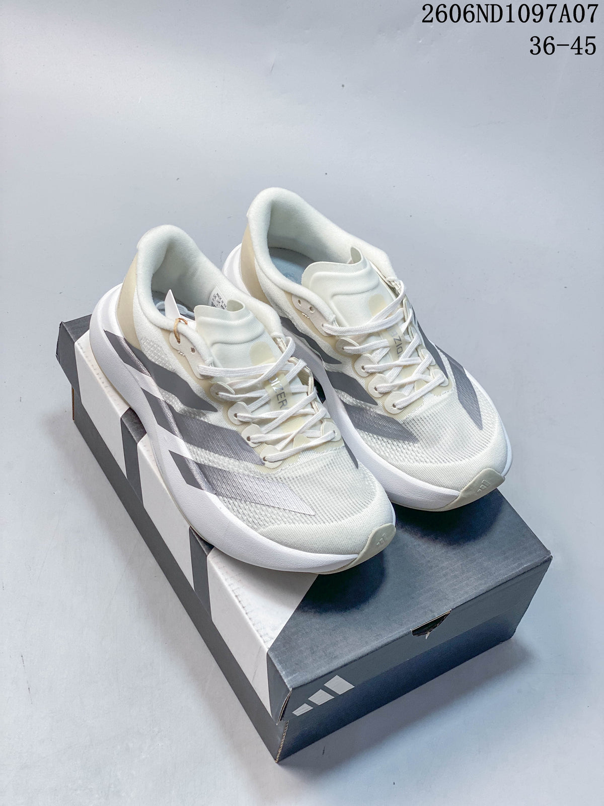 Pair of off-white adidas Adizero Evo SL running shoes with silver stripes, shown on a shoebox.