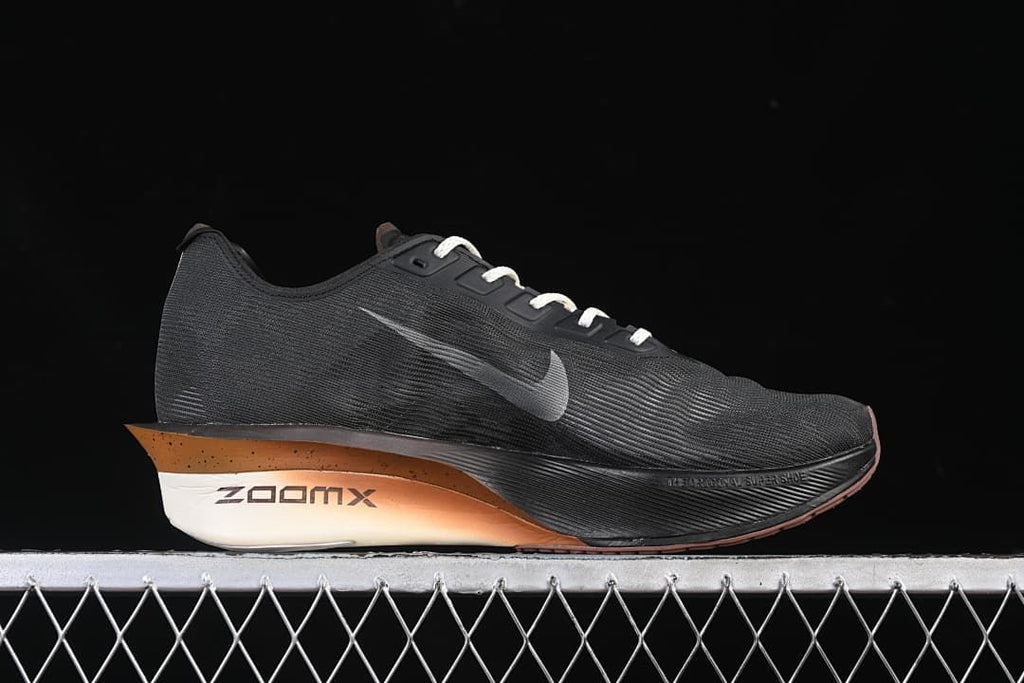 Side profile of the dark running shoe with Swoosh and ZoomX midsole marking.