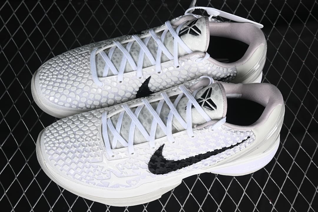 Pair of white low-top basketball shoes shown from above