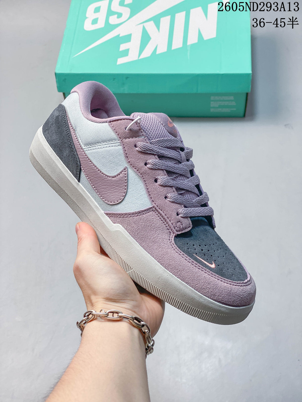 Purple, gray and white Nike SB Force 58 low-top shoe with a ridged outsole