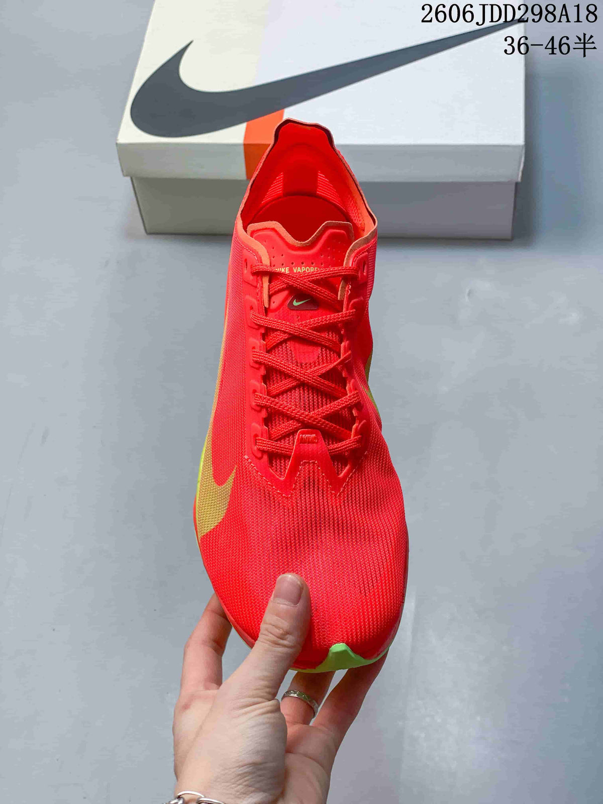 Top view highlighting the red upper and lace-up closure
