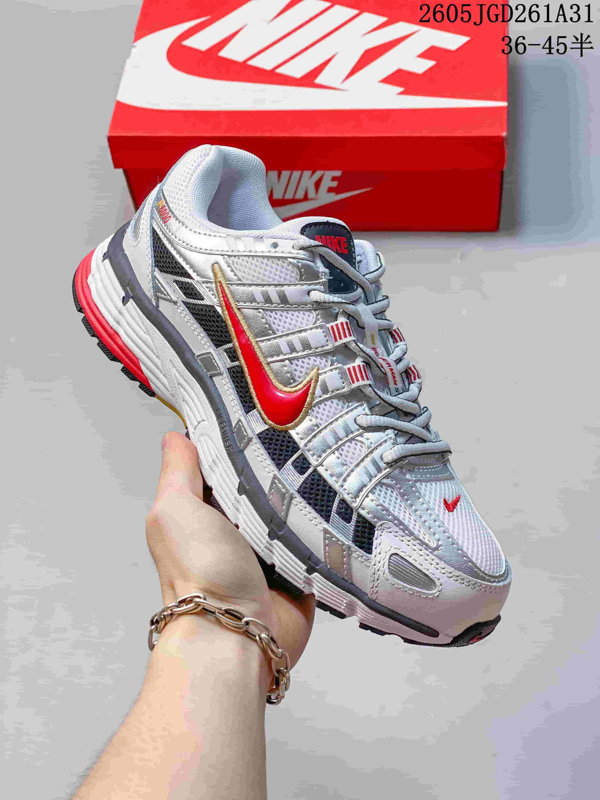 Side view of a white Nike P-6000 sneaker with red and gray accents.