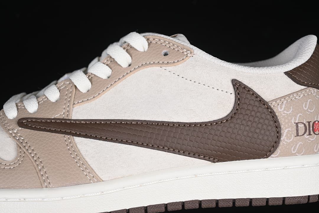 Close-up of the dark brown textured Swoosh against the off-white and beige upper.