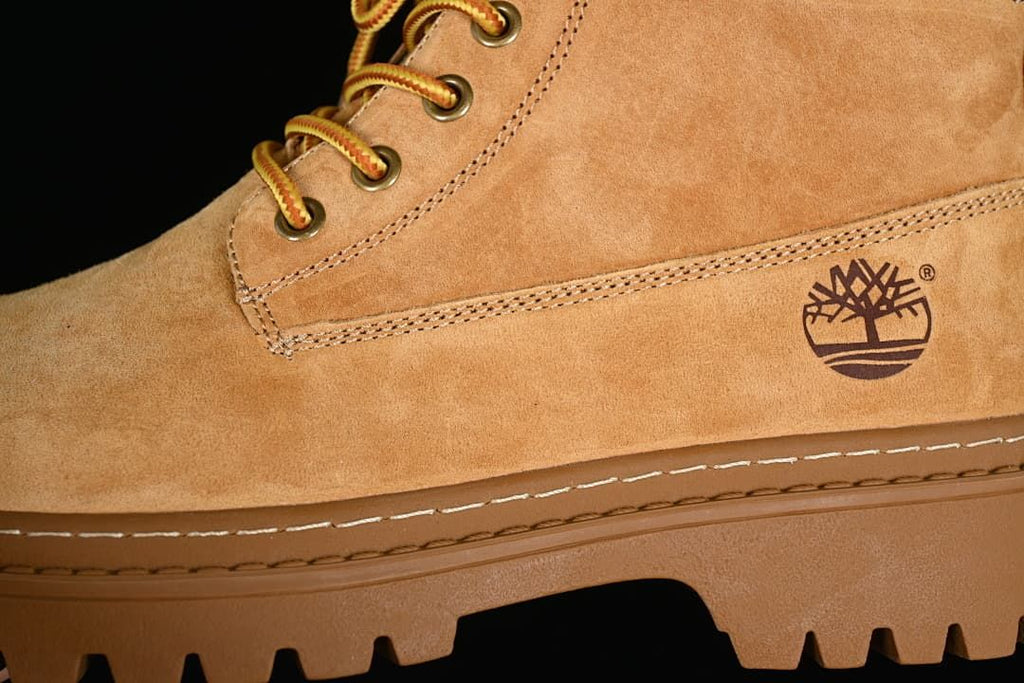 Close-up of the side logo, stitched panels, and metal eyelets