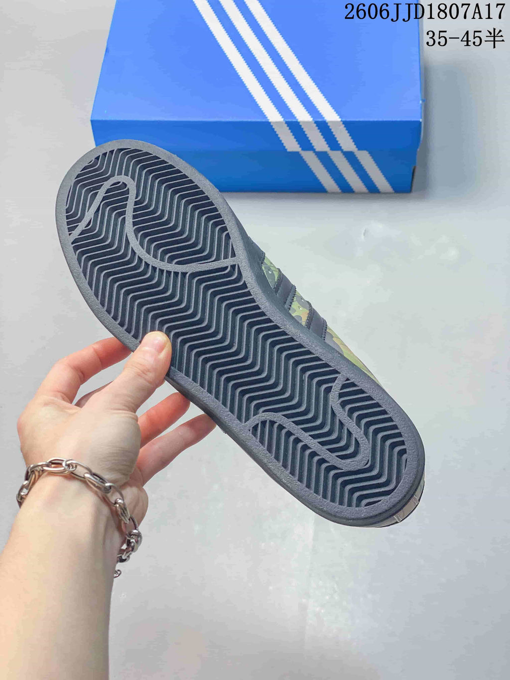 Close-up of the sneaker's dark patterned outsole