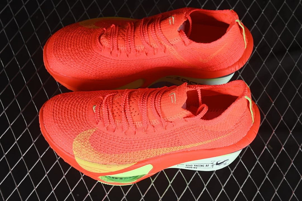 Pair of bright crimson running shoes shown from an angled top view