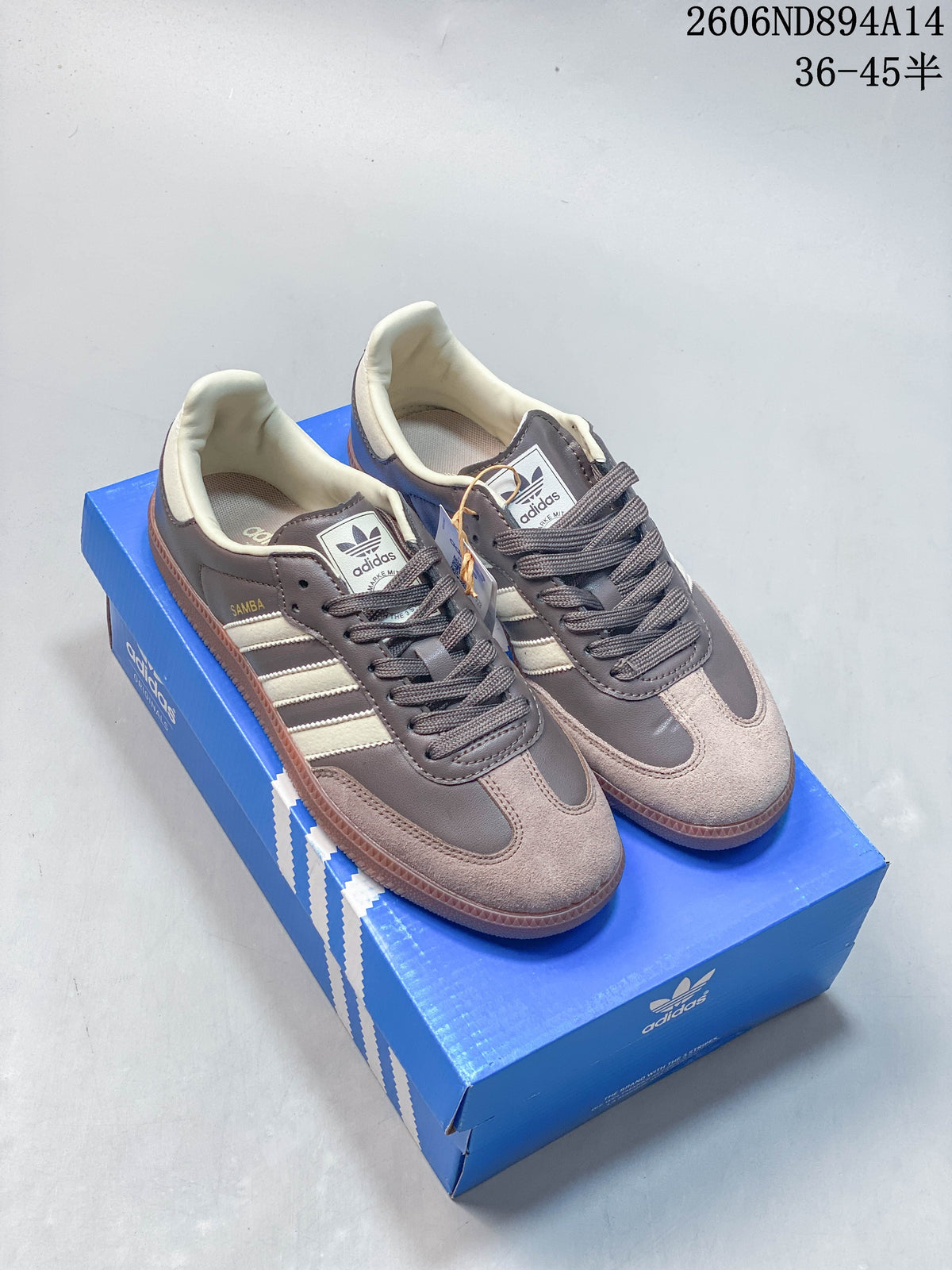 Pair of brown and cream adidas Samba OG low-top sneakers on a blue box