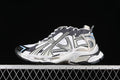 Side view of a beige, white and charcoal Balenciaga Runner sneaker with light blue accents.