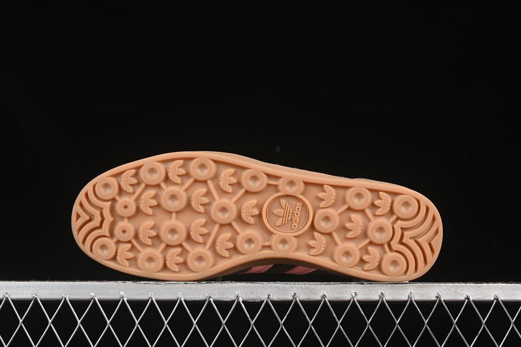 Underside showing the patterned gum-colored outsoles.