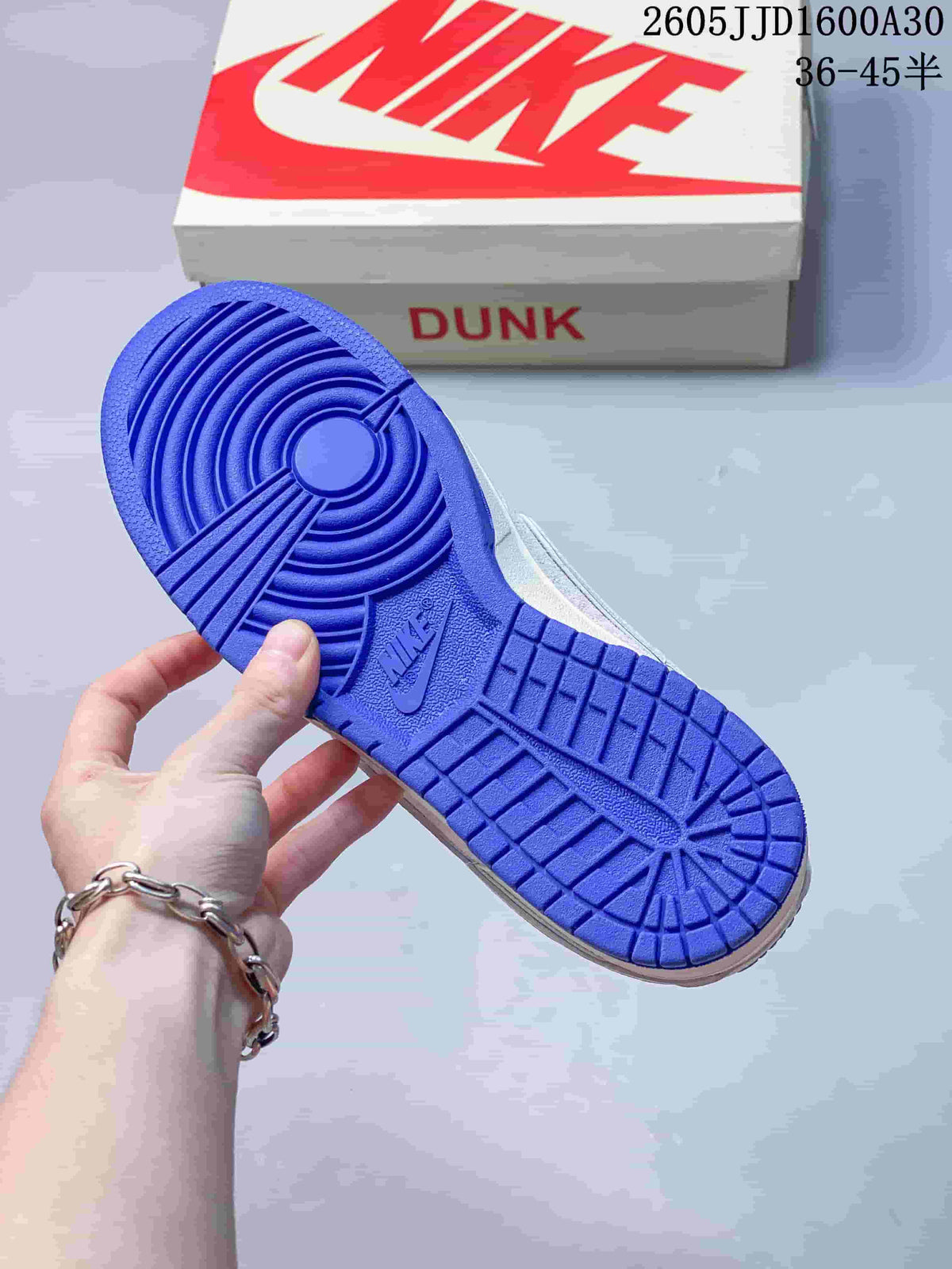 Blue outsole of a Nike SB Dunk Low sneaker