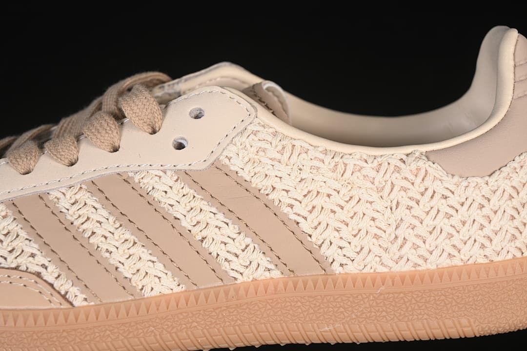 Close-up of woven upper, three side stripes, beige laces and gum outsole