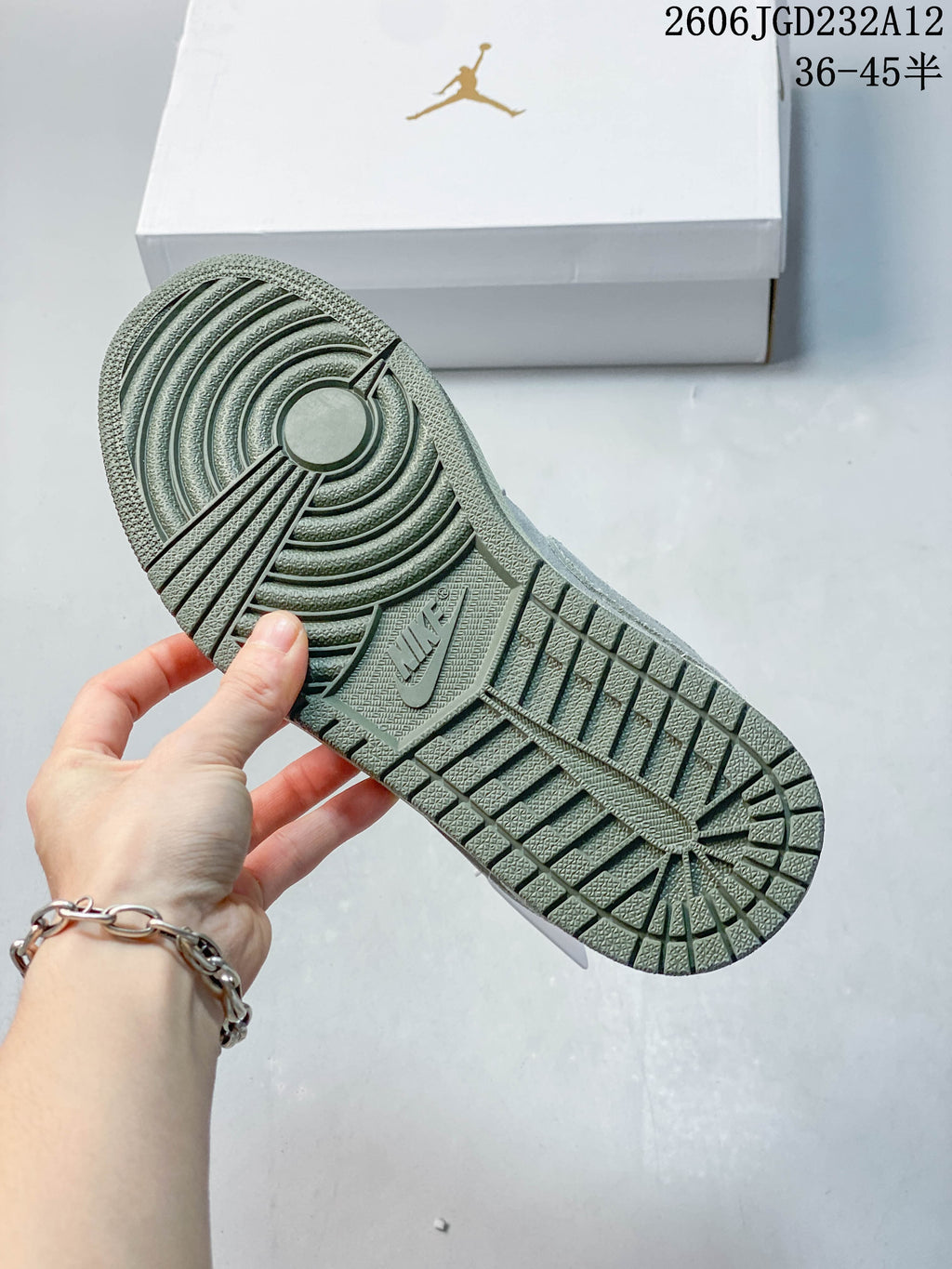 Close-up of the patterned muted green outsole