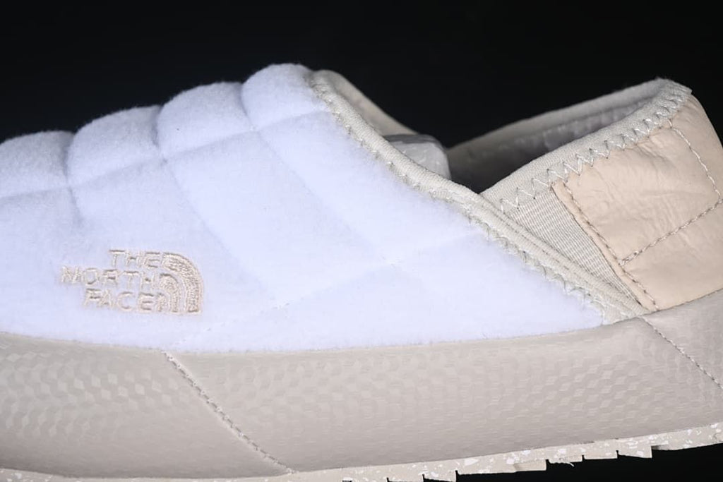 Side detail of the quilted upper, logo, and sole