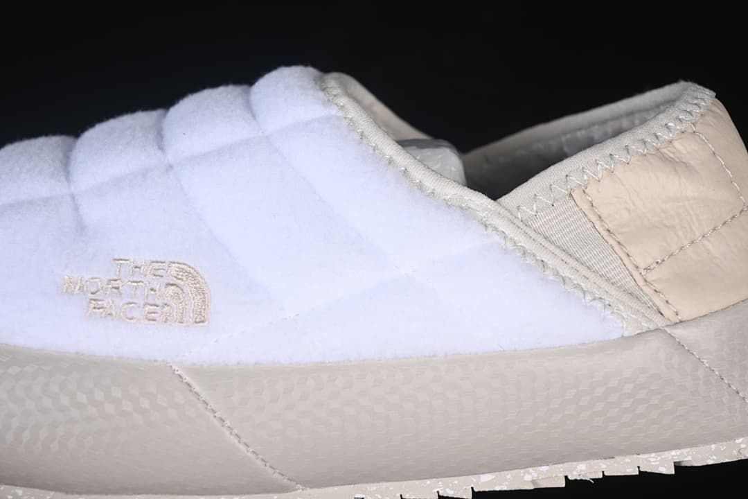Side detail of the quilted upper, logo, and sole