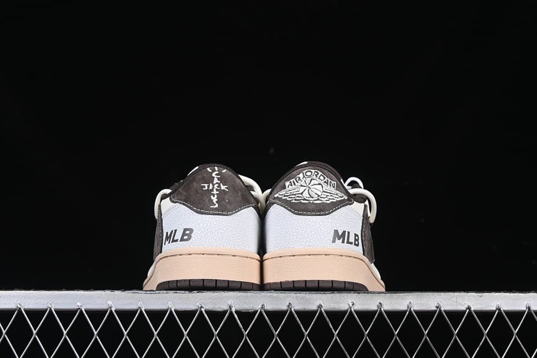 Rear view of the pair with dark heel panels and MLB graphics