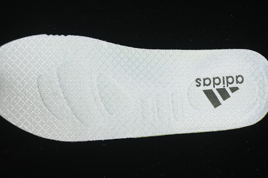 Light-colored insole with Adidas branding