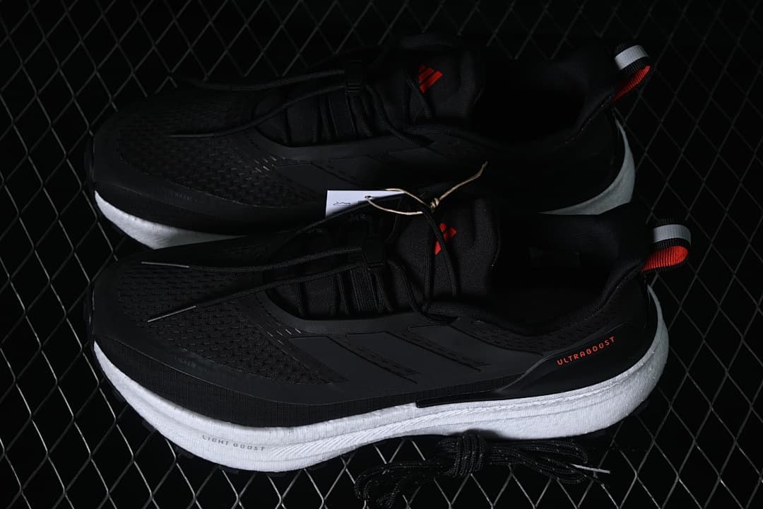 Pair of black adidas Ultraboost 5 shoes shown from above and the side.