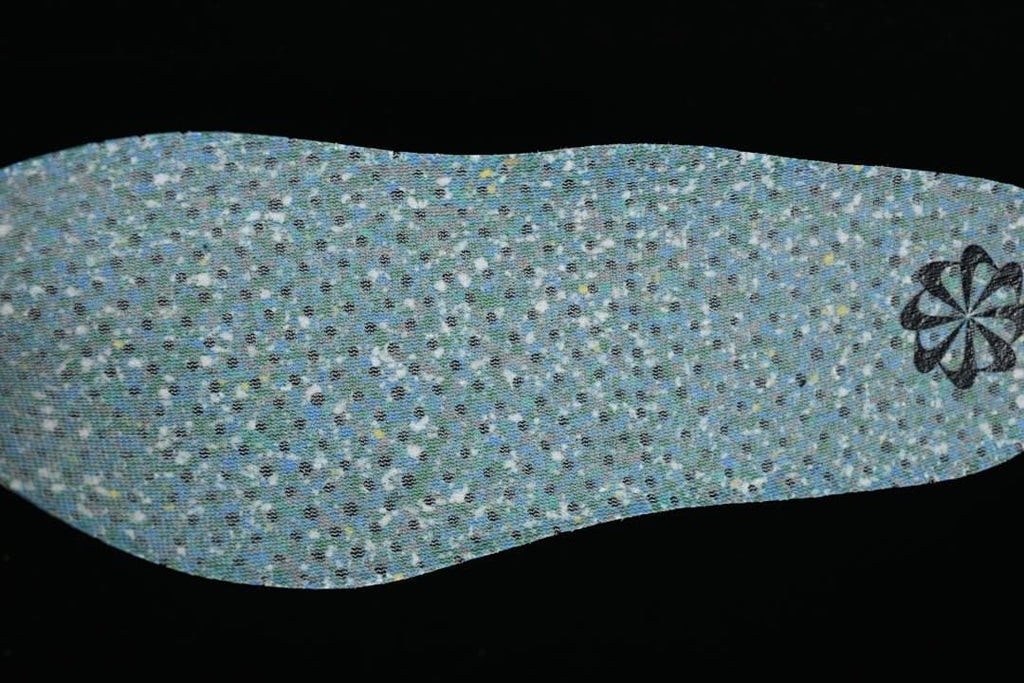 Reverse side of a blue-toned textured shoe insert.