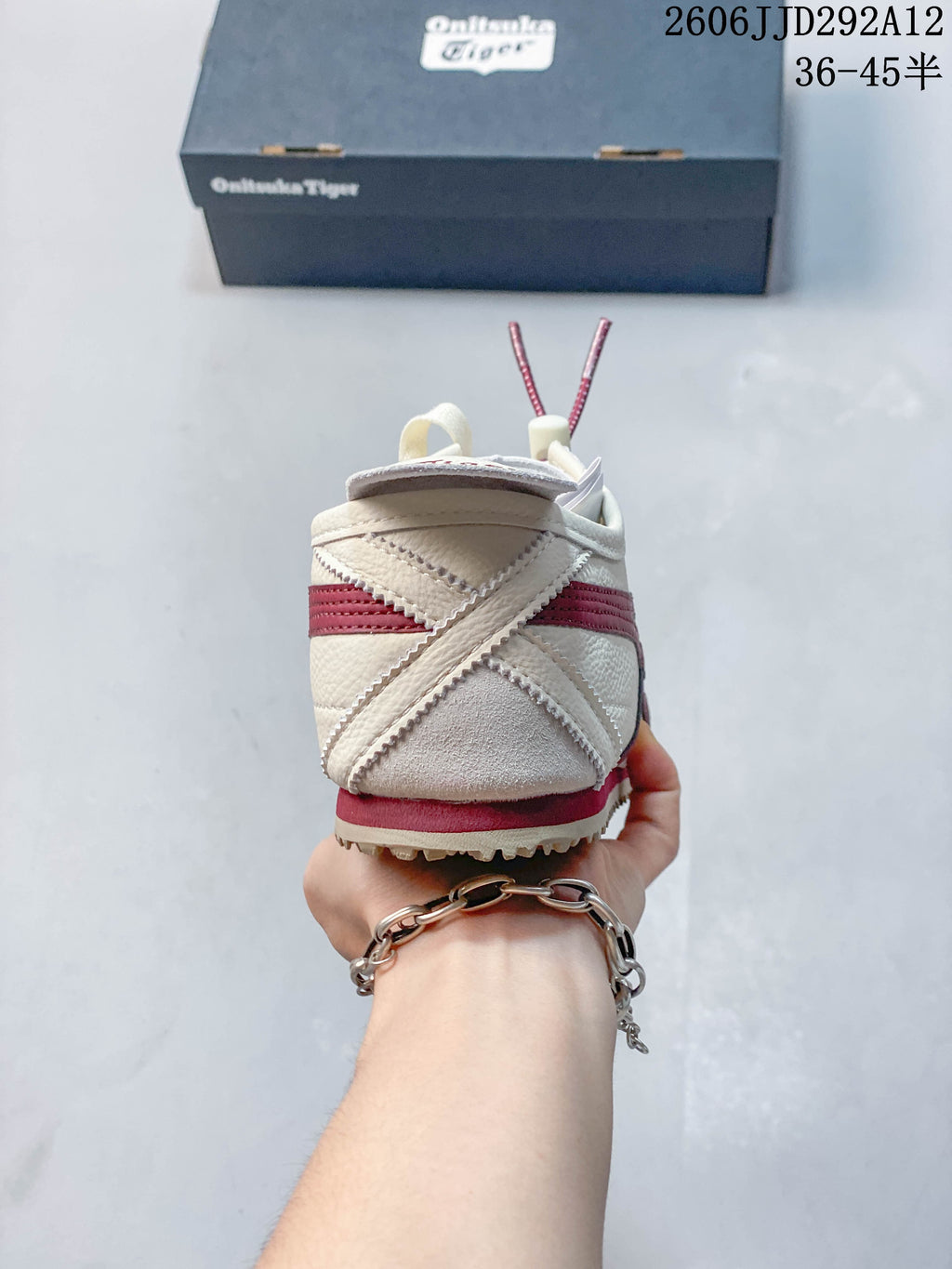Rear view showing the heel details and layered panels of the sneaker