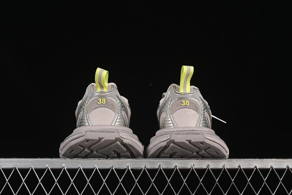 Rear view of both sneakers with patterned outsoles visible