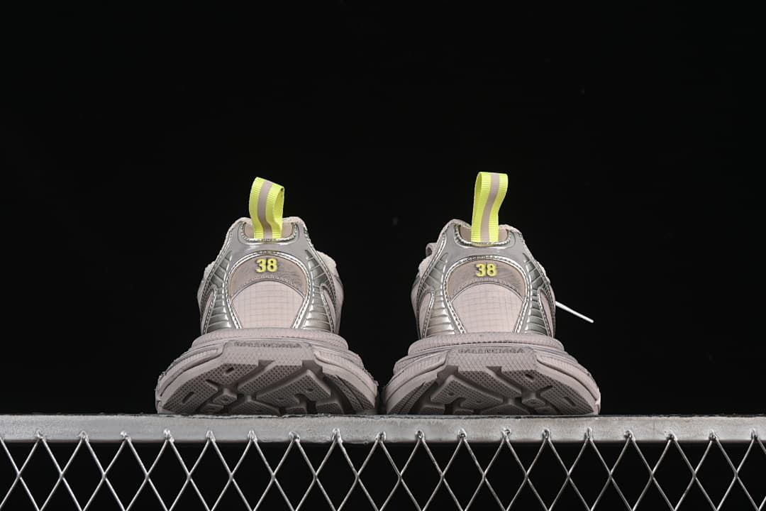 Rear view of both sneakers with patterned outsoles visible