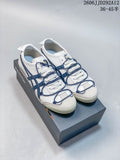 Pair of white and navy Onitsuka Tiger Mexico 66 Deluxe sneakers on a shoebox; photo overlay shows style code JD292A12 and size range 36–45.5.