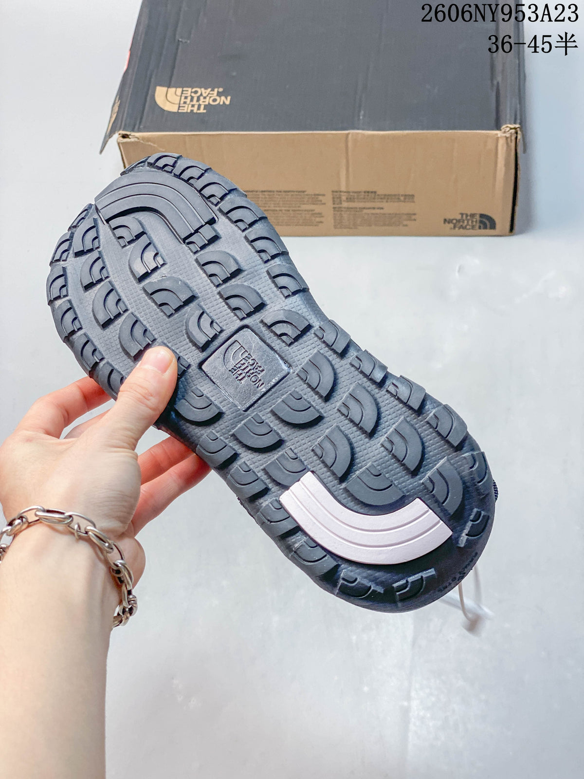 Close-up of the sandal outsole showing its lugged tread pattern.