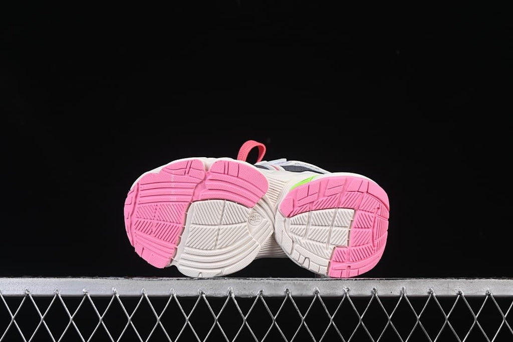 Underside view showing the patterned pink and white outsoles.