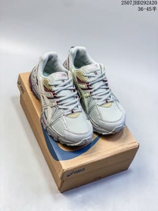 Pair of gray ASICS Gel-Kahana 8 FL sneakers displayed on an ASICS shoebox.